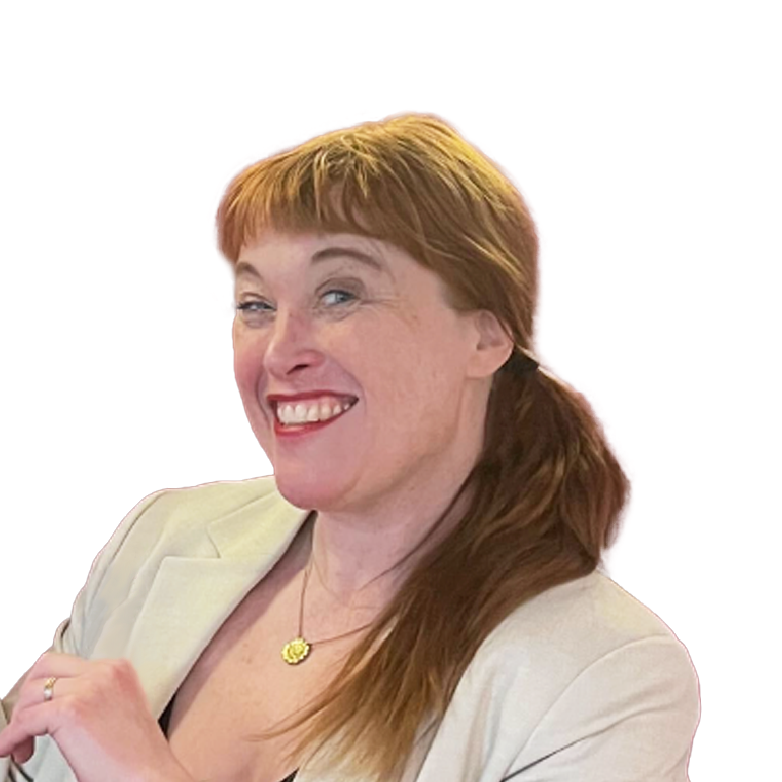 Headshot of a smiling woman with blond hair smiling.