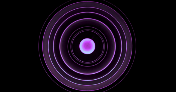 A pink orb has a series of lit up radiating circles flowing out on a dark background.